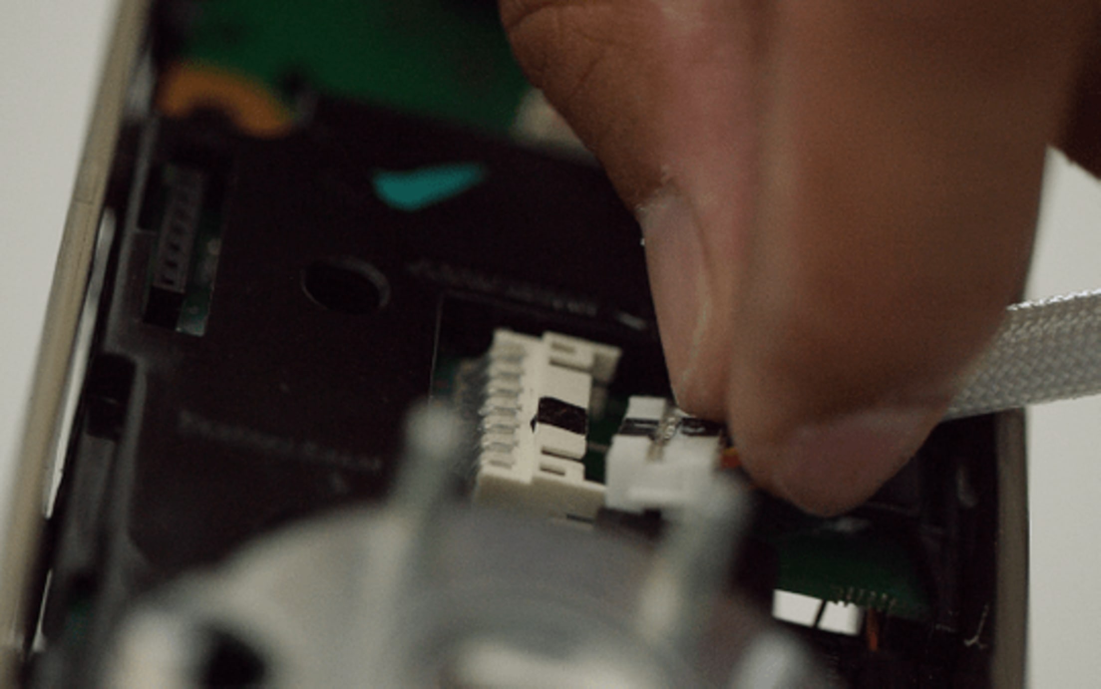 Connect the cable to the adaptor, located on the inside of the interior lock.
