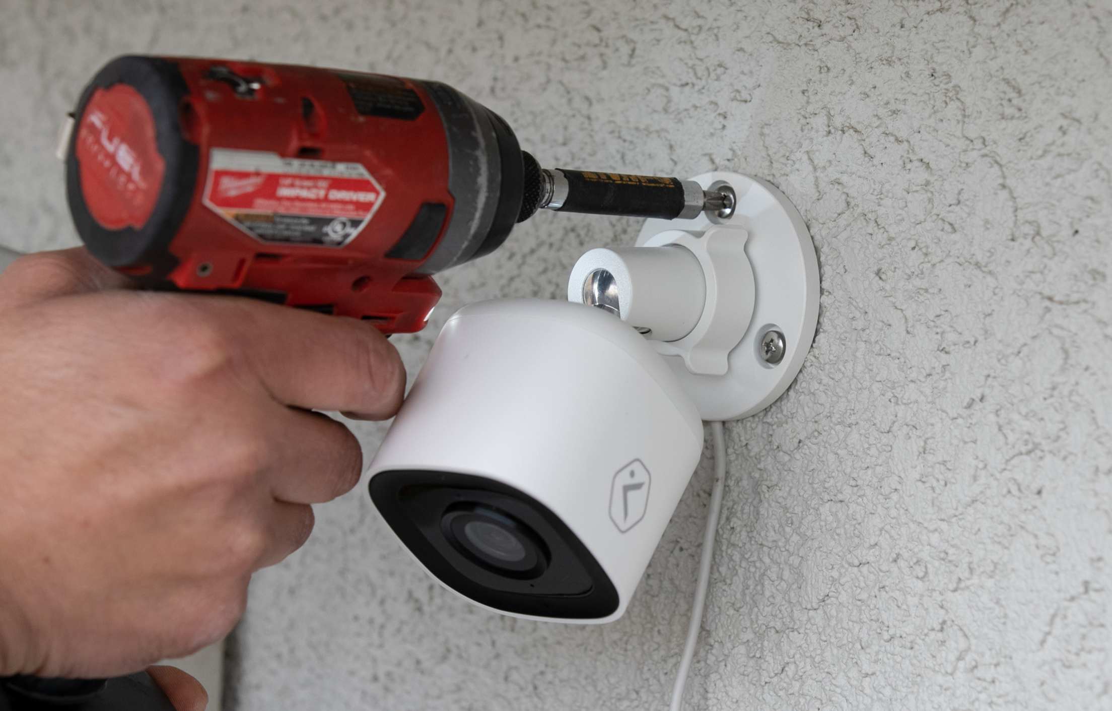 Screwing camera to wall