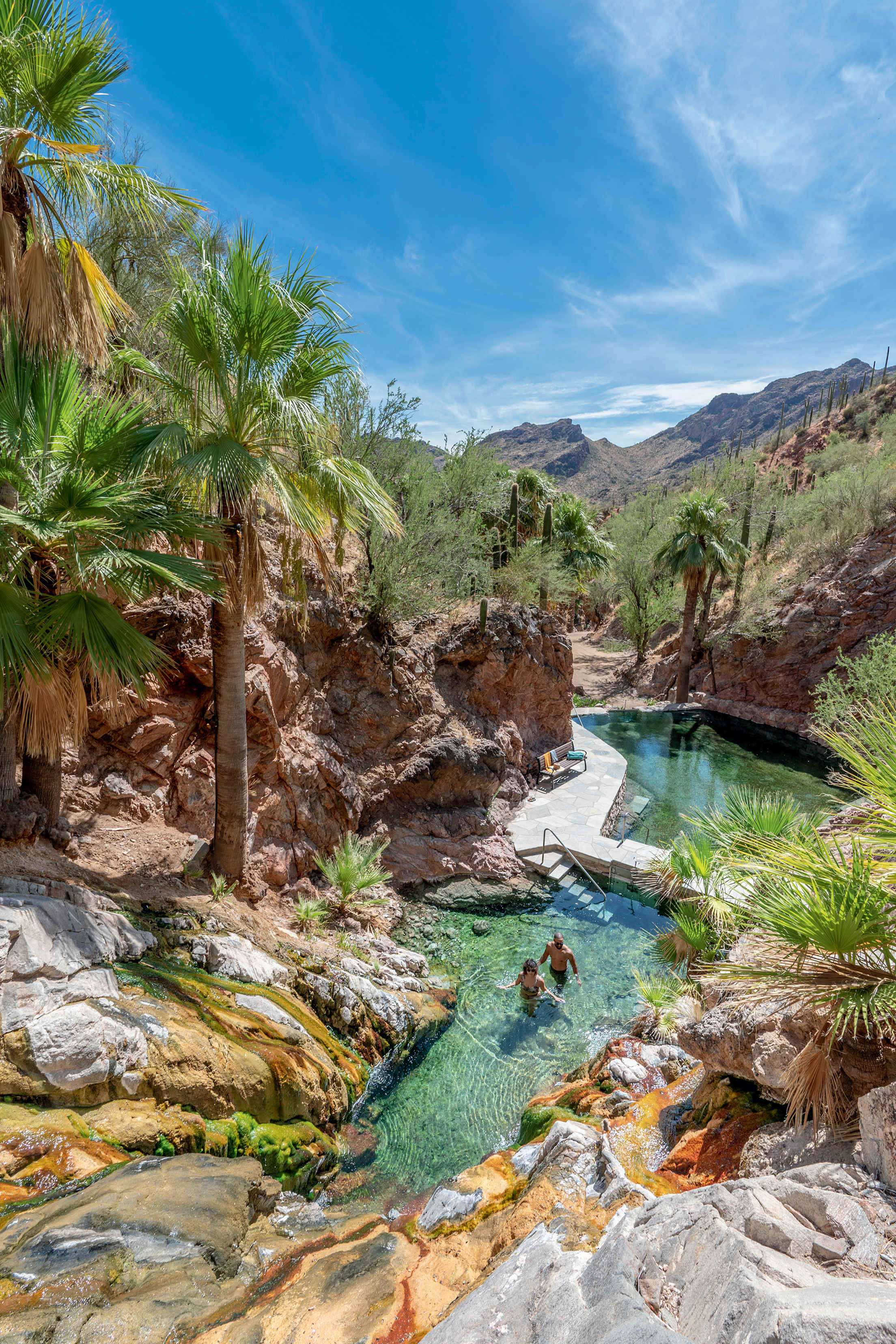 Two people soak in Castle Hot Springs in Morristown, Arizona.