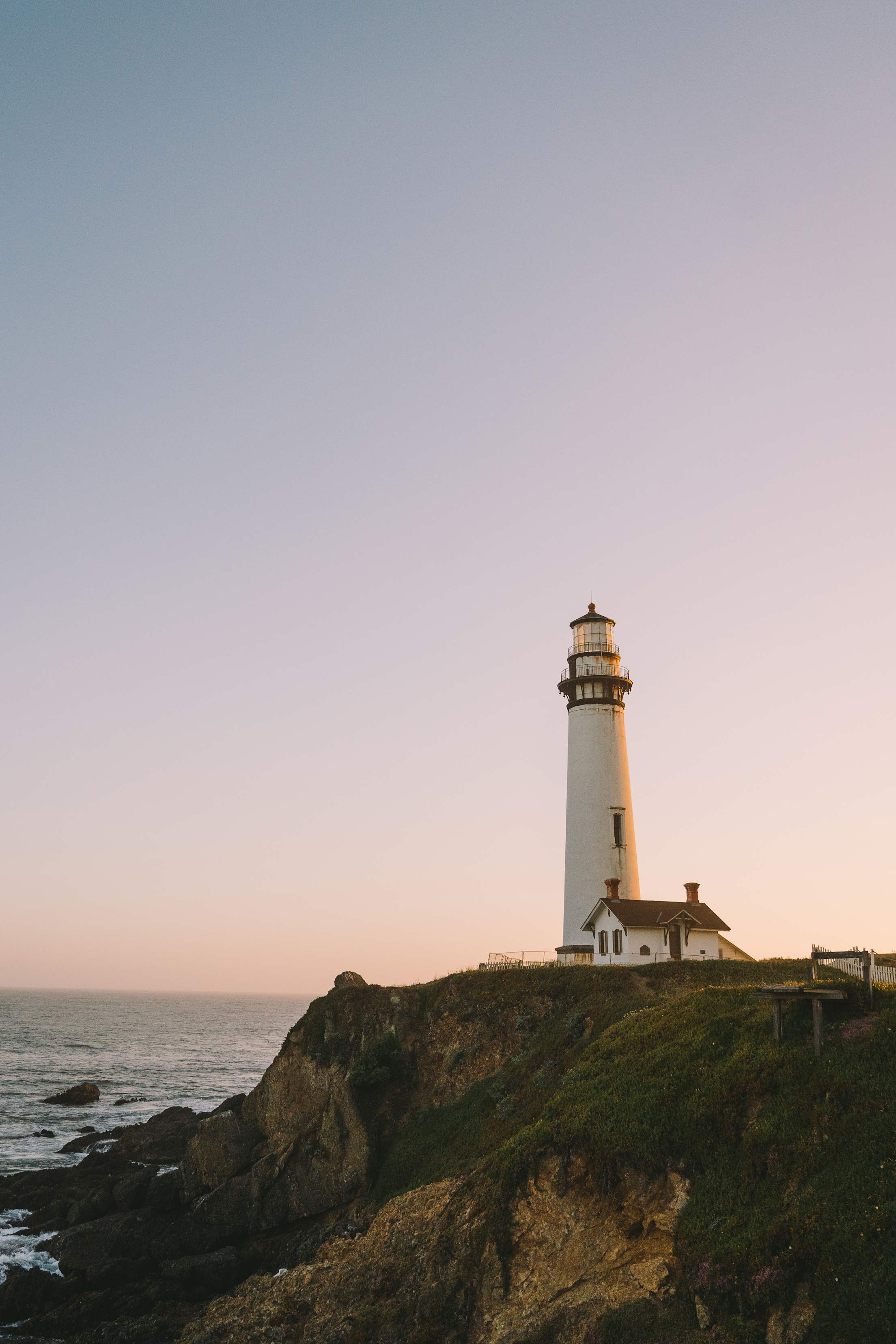 Pigeon Point Lighthouse on the Pacific coast in Pescadero, California at sunset.