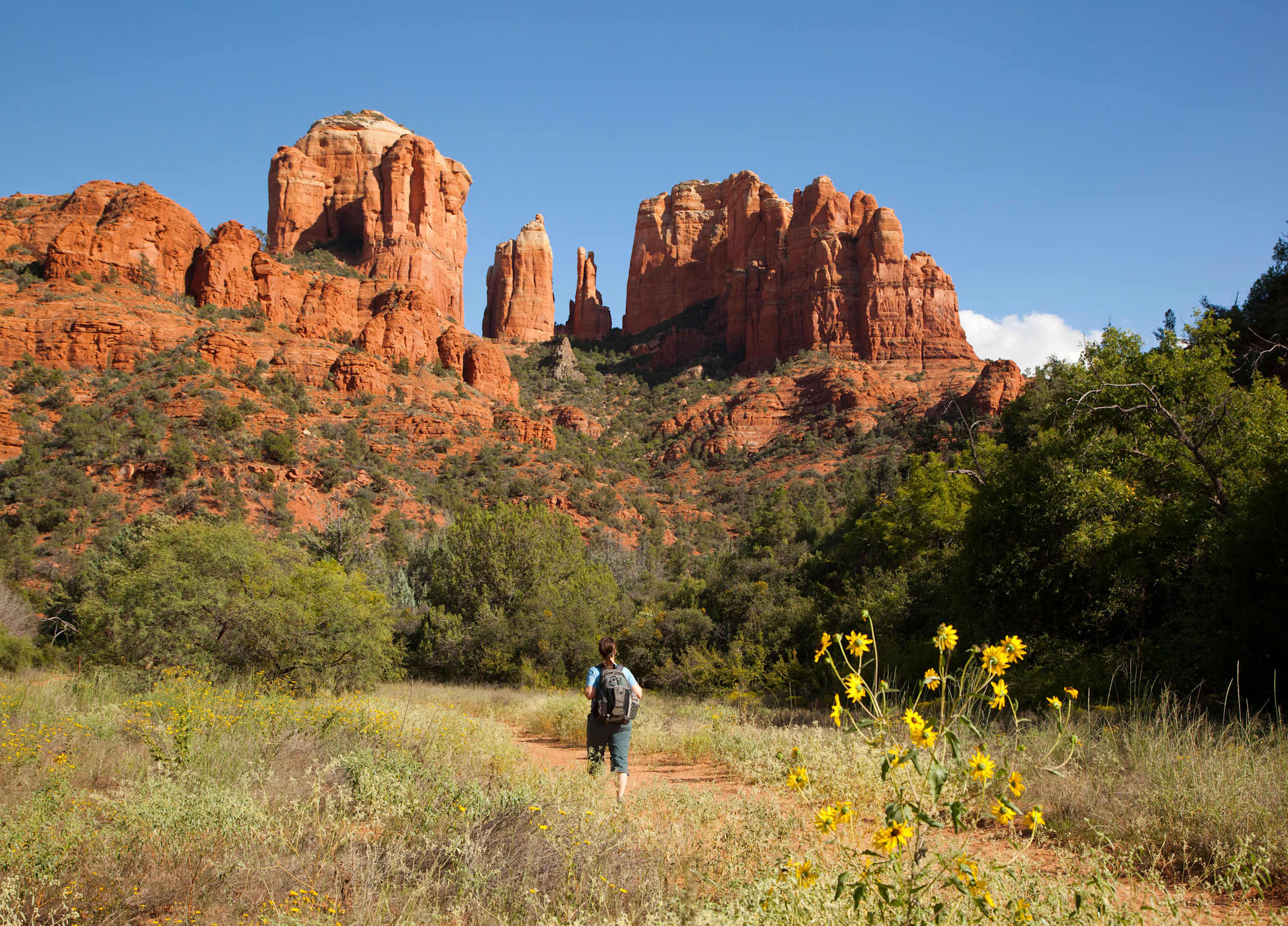 Woman hiking to Cathedral Rock in Sedona, Arizona.