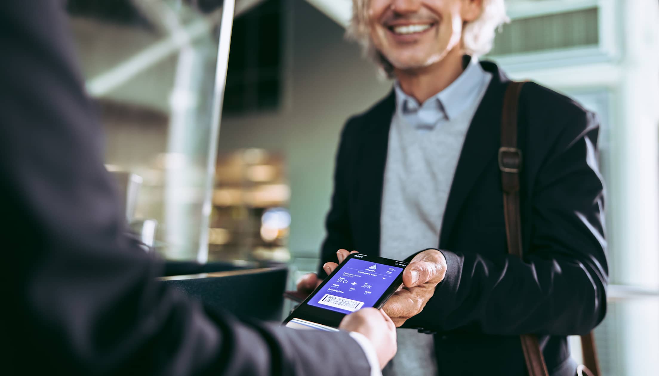 A traveler checks in with a digital airline ticket.