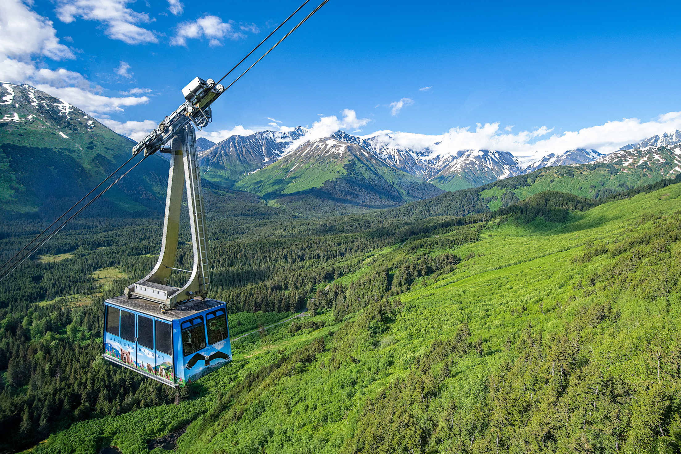 Alyeska Aerial Tram heads up the mountain on a clear summer day in Girdwood, Alaska.