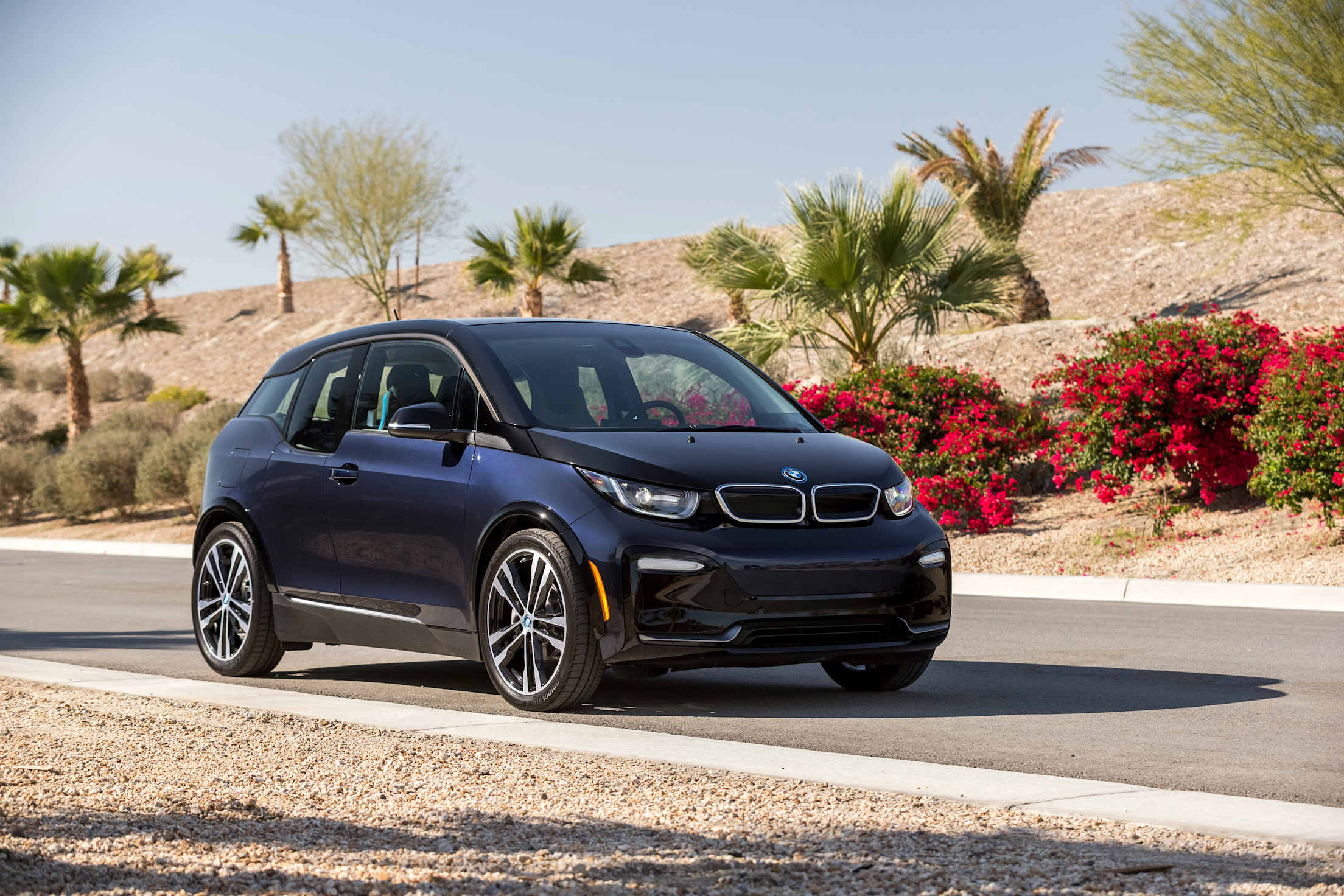 BMW i3 on a desert road.