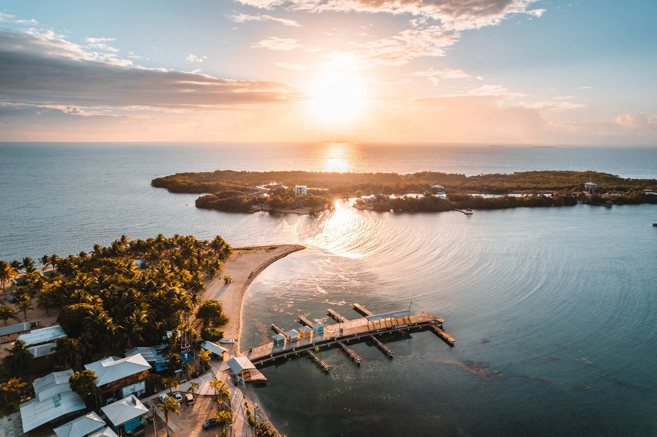 The sun reflects off the ocean on the shore of Placencia in southern Belize.