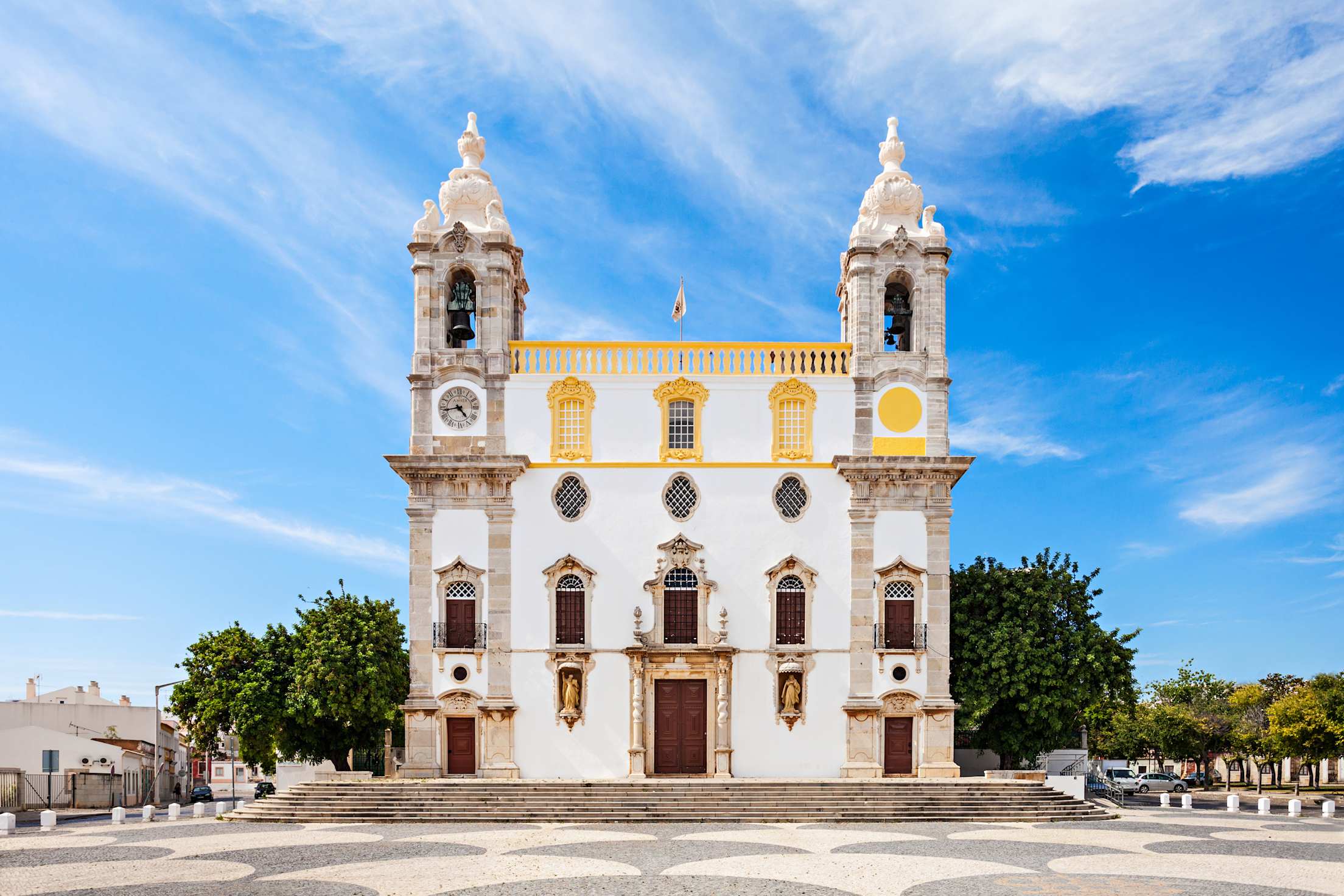 The exterior of Carmo Church (Chapel of Bones) in Faro, Portugal on a sunny day.