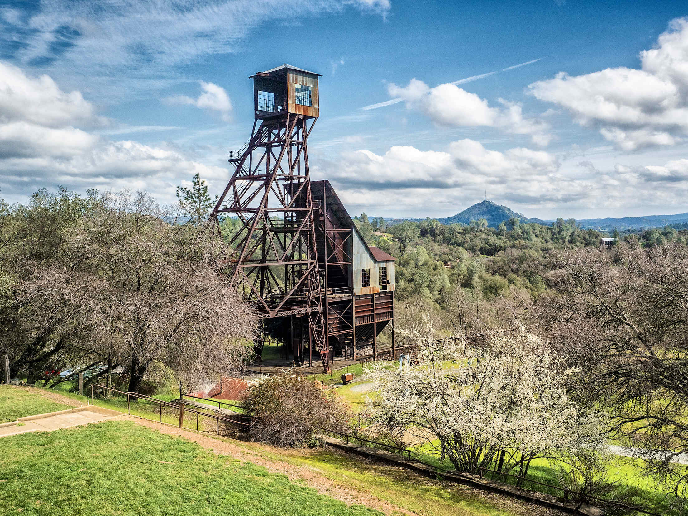 Historic Kennedy Gold Mine in Jackson, California, on a partly cloudy day.