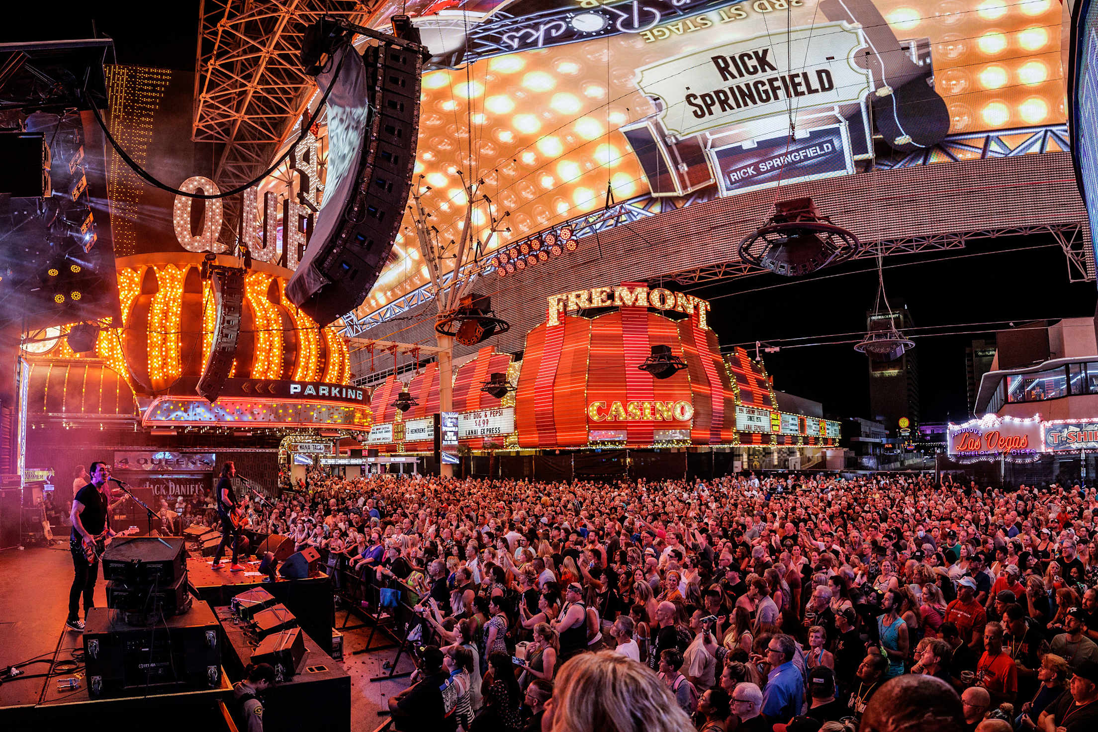 A crowd watches a band play during the Fremont Street Experience 2022 Downtown Rocks Concert Series.