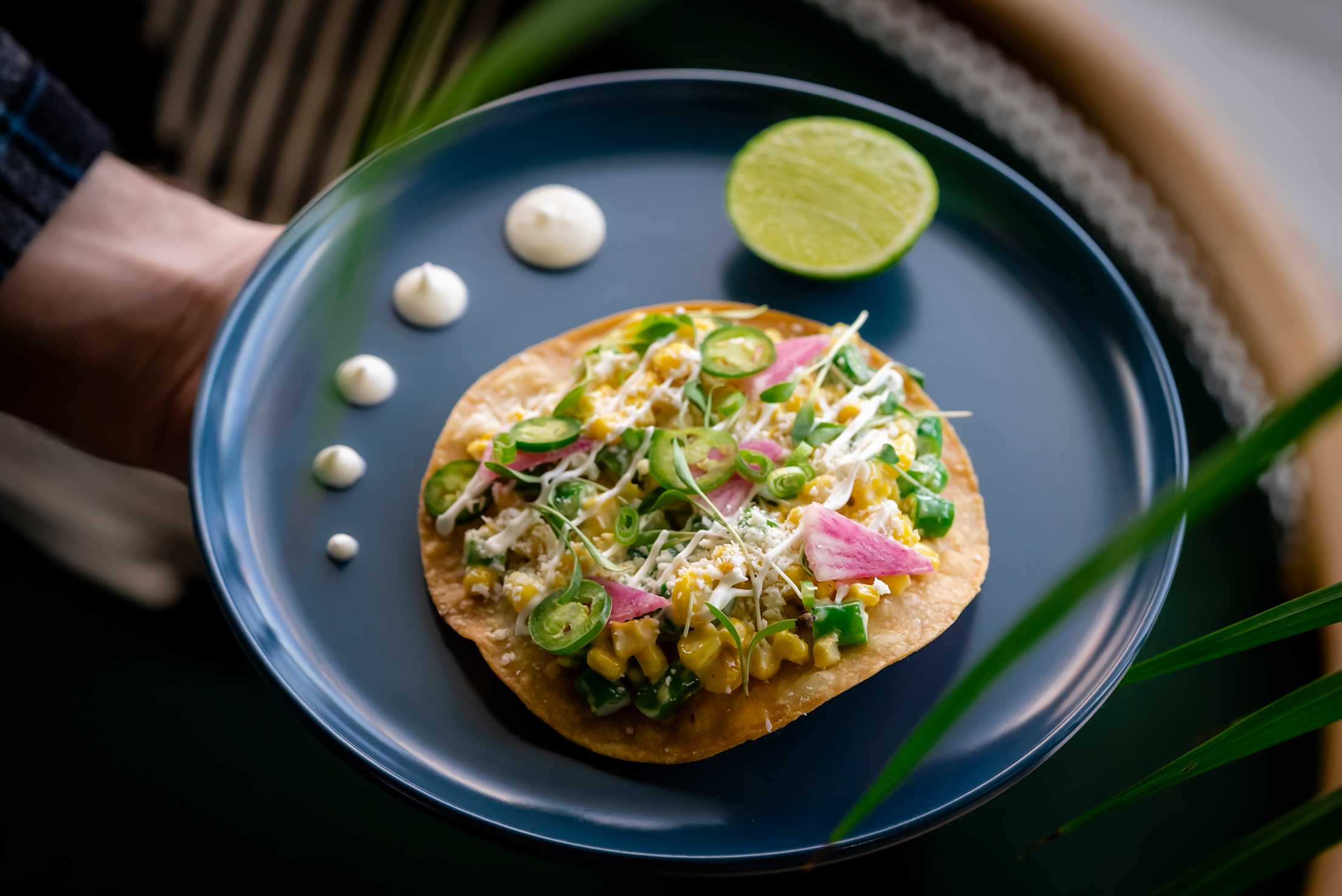 an upscale taco on a corn tortilla on a blue plate