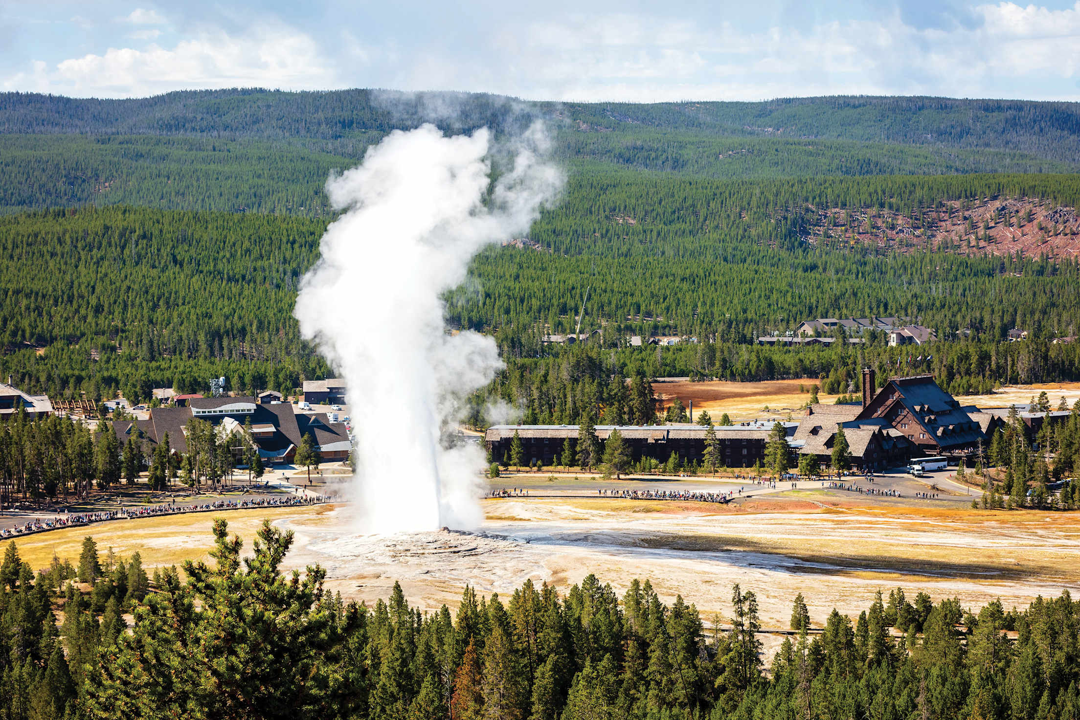 Old Faithful Geyser erupts in Yellowstone National Park.