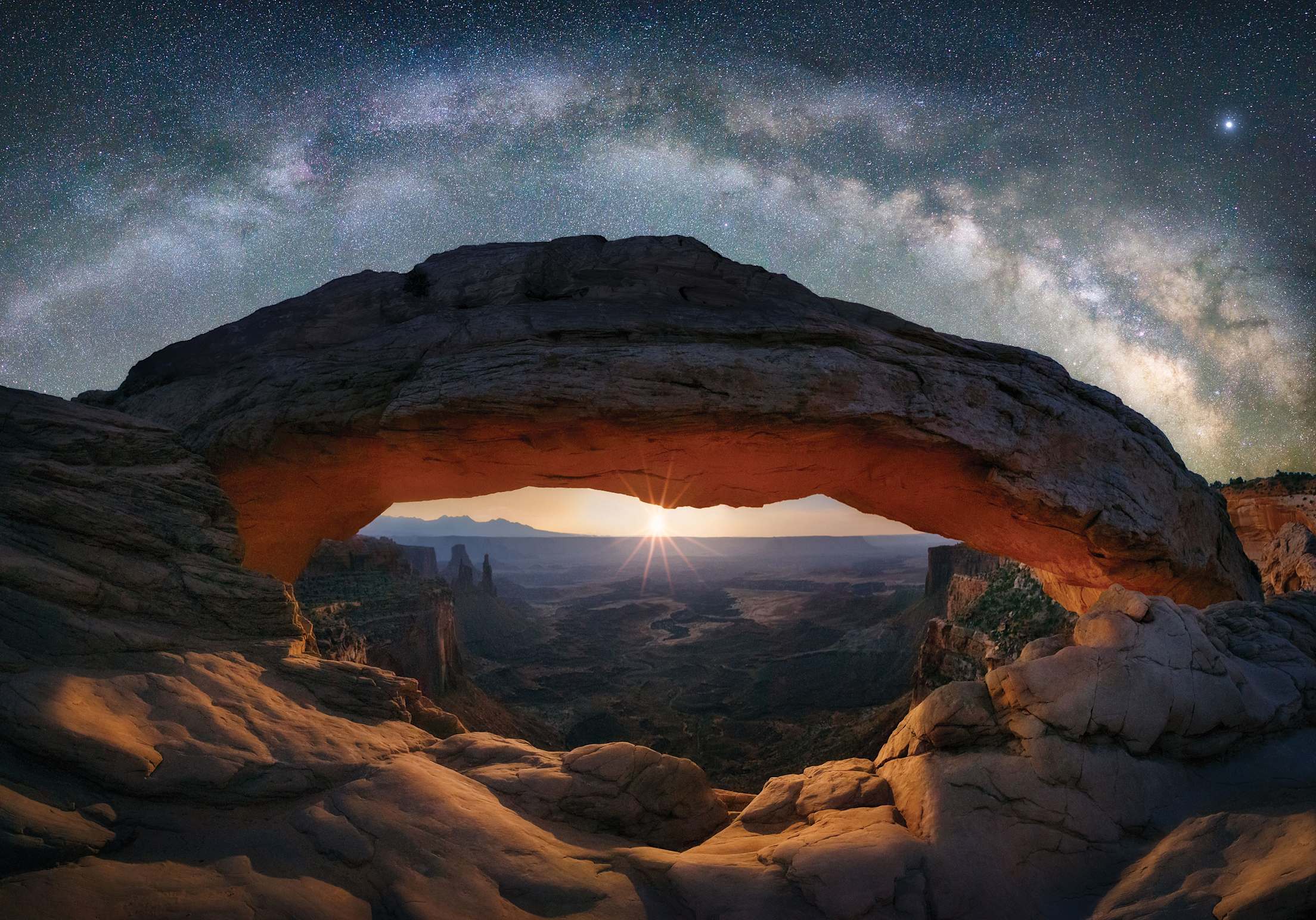 The Milky Way and stars over Mesa Arch in Canyonlands National Park, Utah