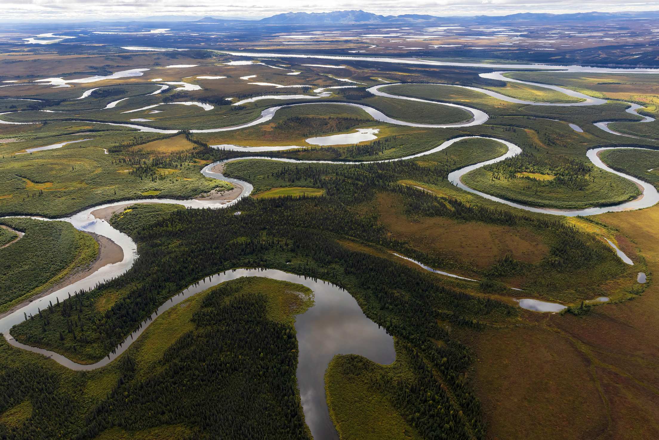rivers wind through green valleys in Alaska