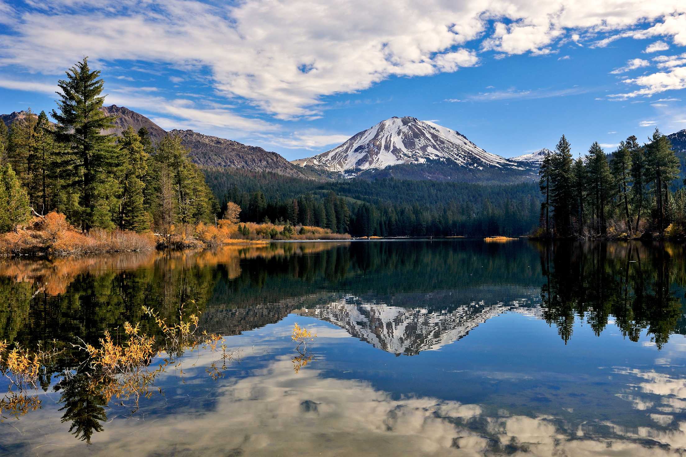 Lassen Peak reflects on Manzanita Lake in Lassen National Park.