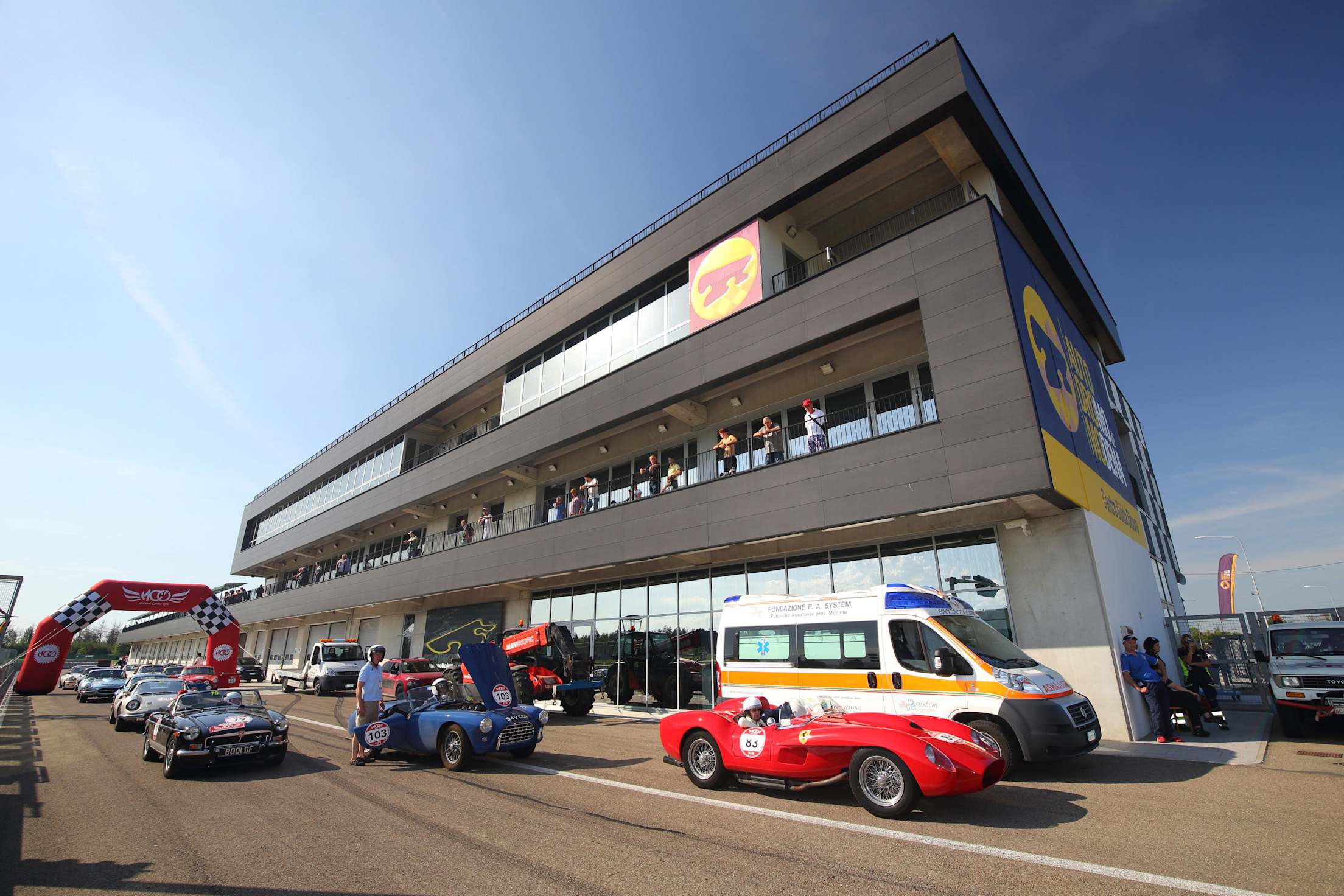 Various sports cars lined up at the Modena Autodrome race track.