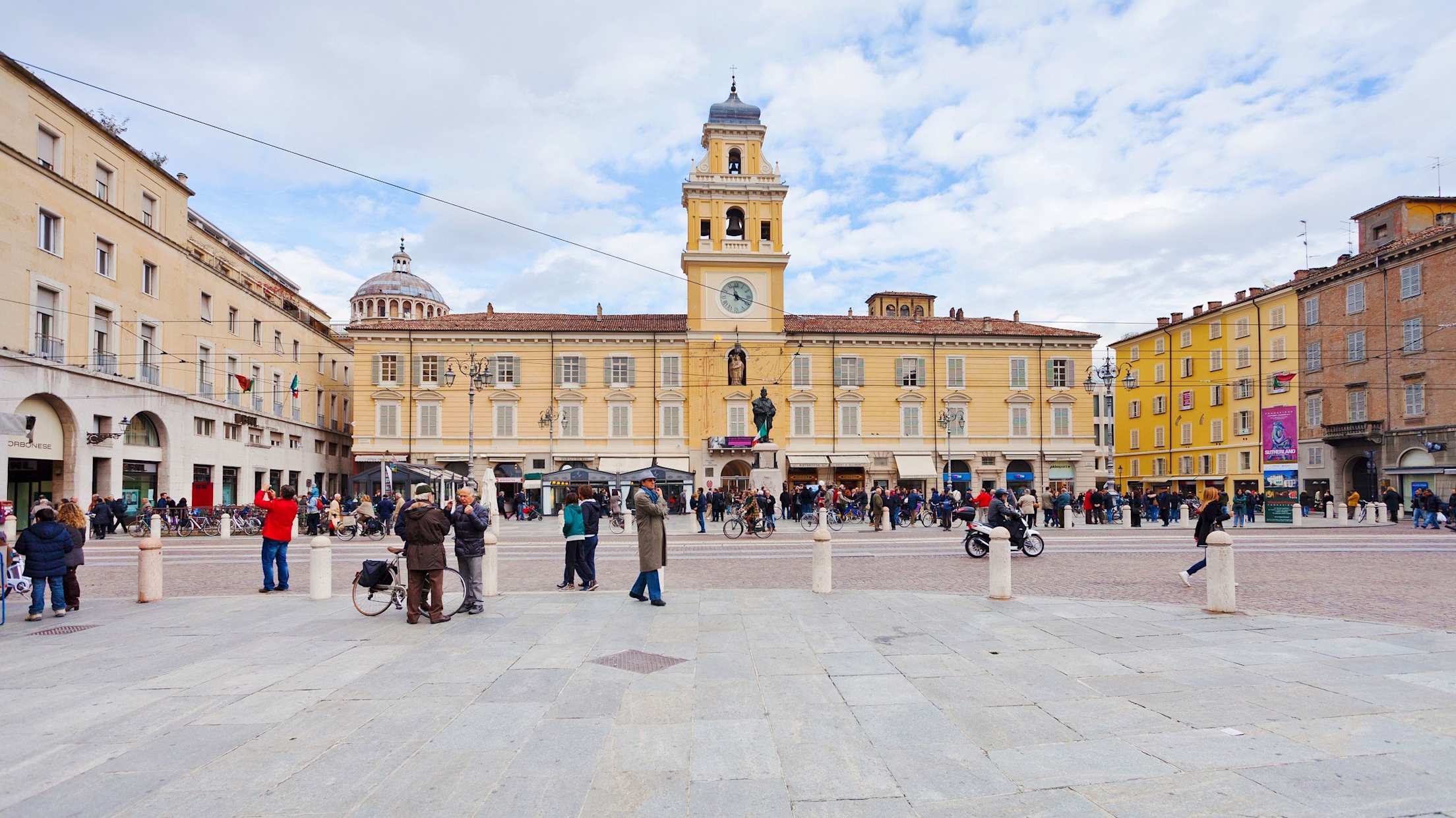 Centuries-old buildings frame a bustling plaza