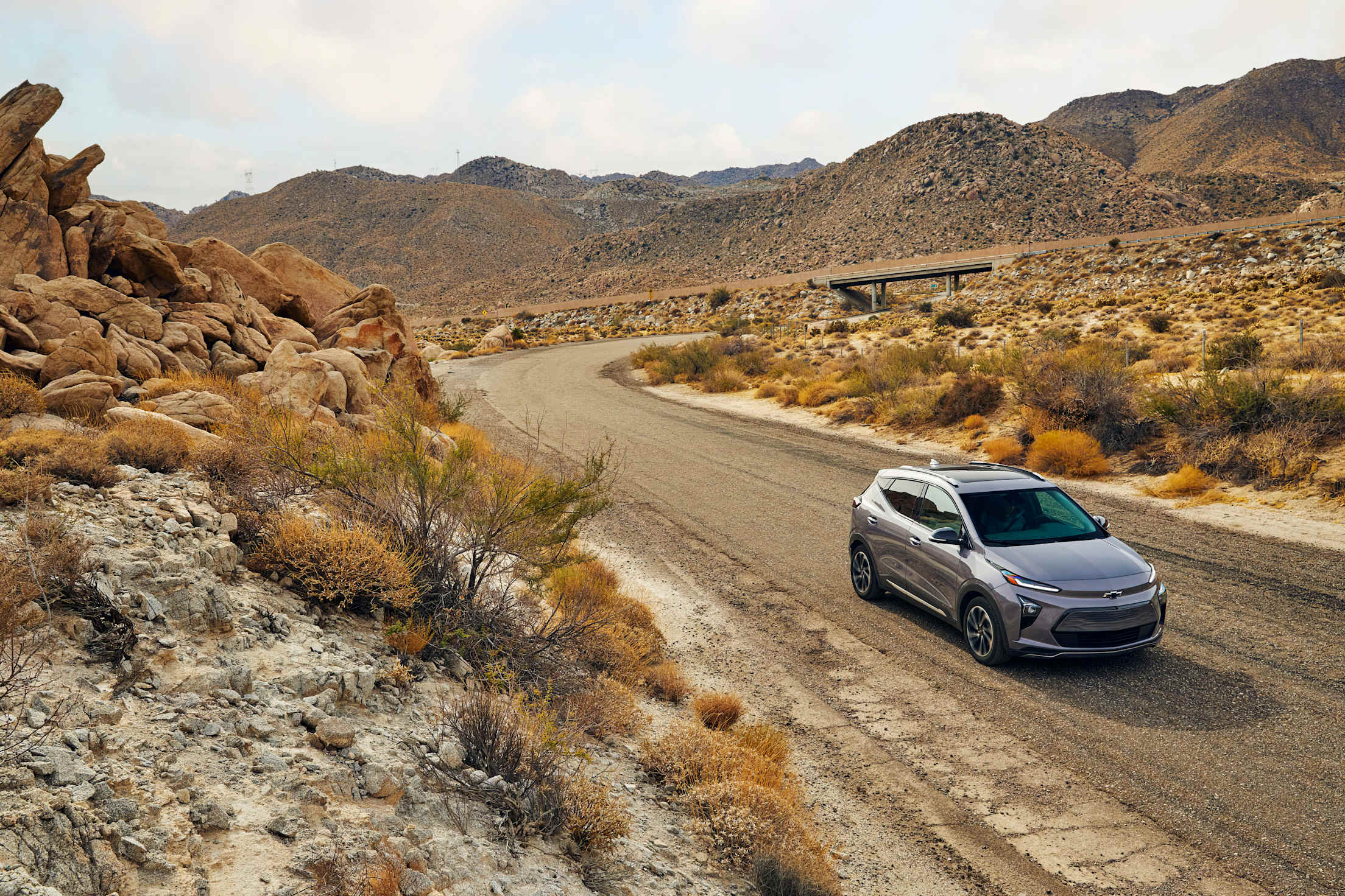 A Chevy Bolt EV on a desert backroad