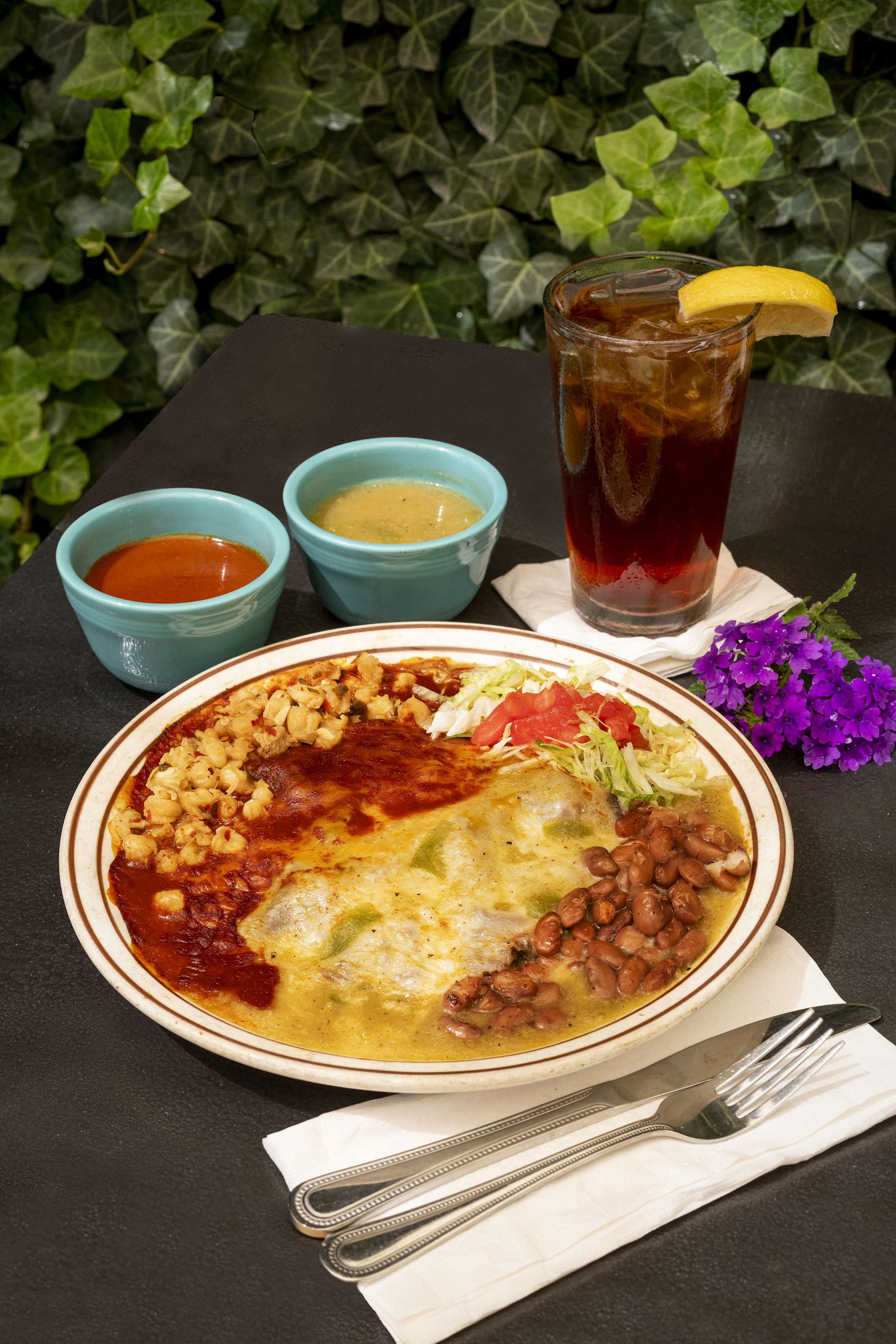 red and green enchiladas on a plate
