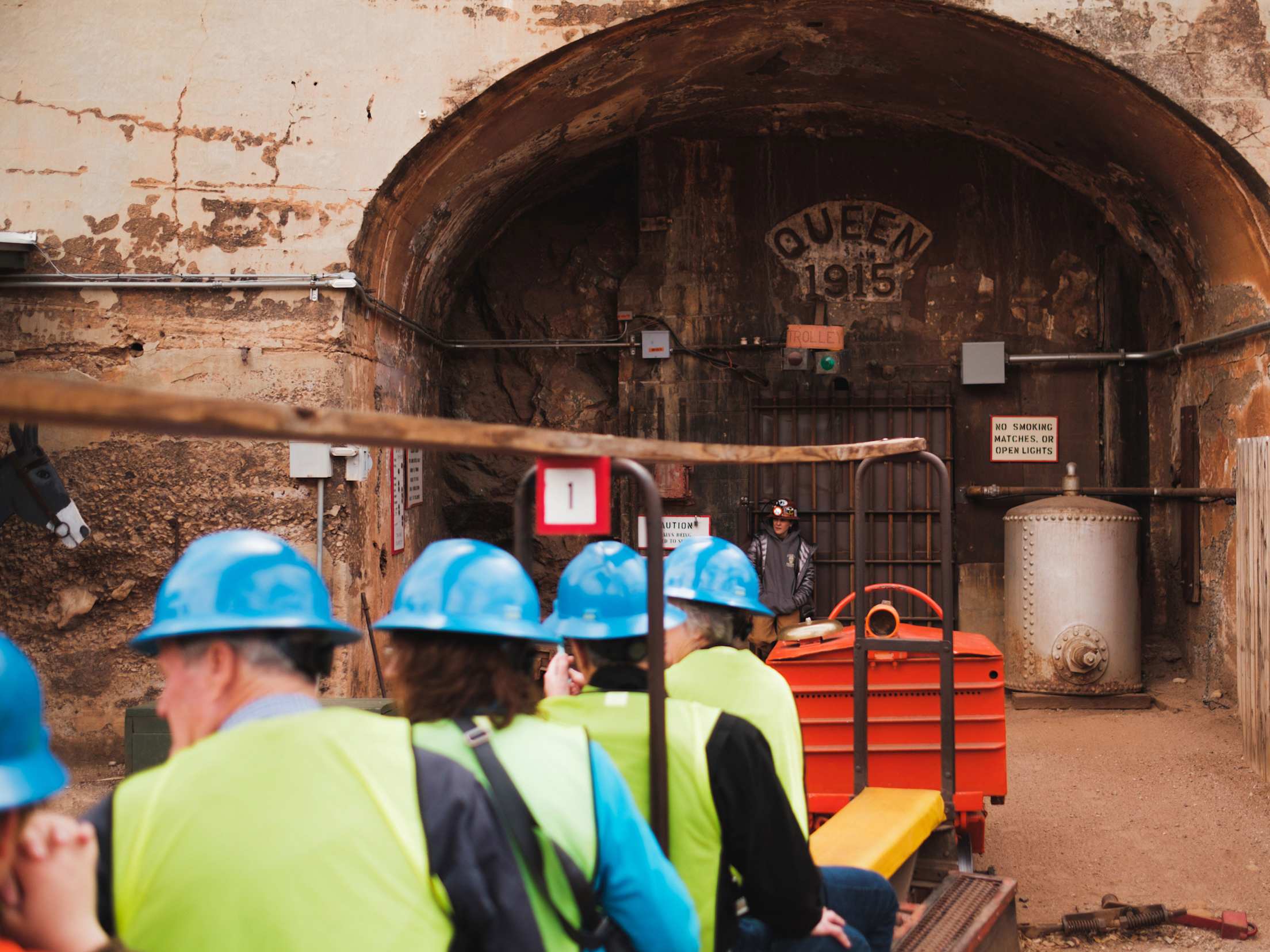 People wait for the start of a tour at the Copper Queen Mine in Bisbee, Arizona.