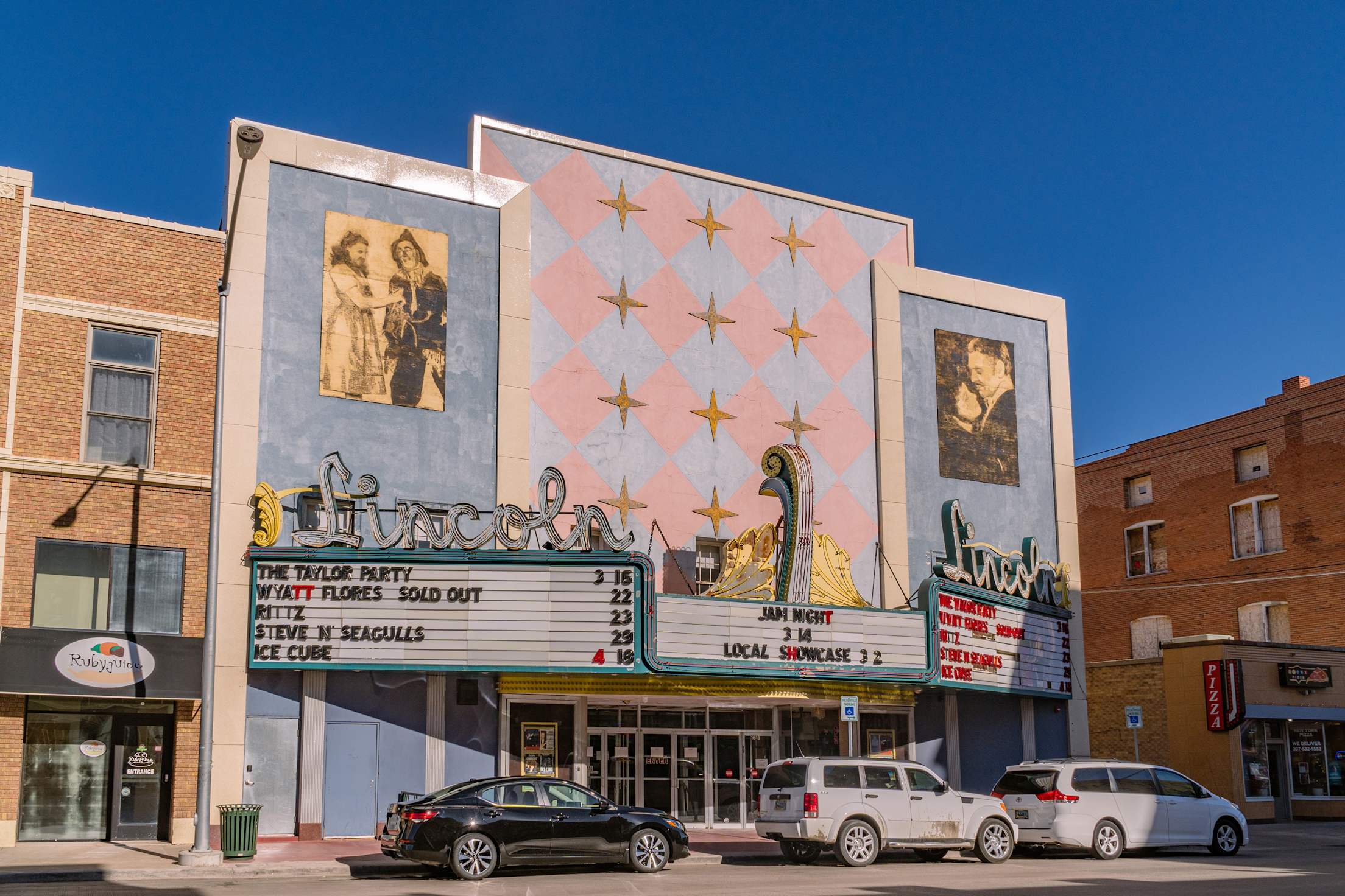 a marquee on a historic theater with text out front reading 'the lincoln'