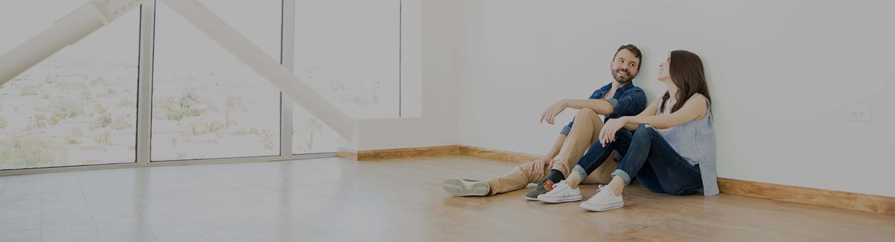 a couple with AAA Renters Insurance enjoys their new apartment