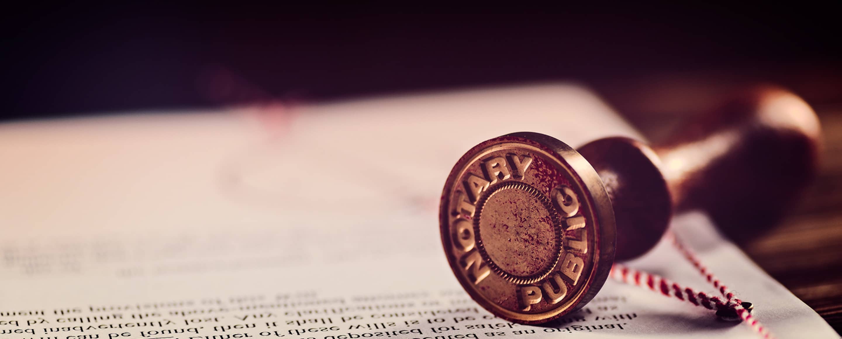 Notary public stamp on a document being notarized at AAA.