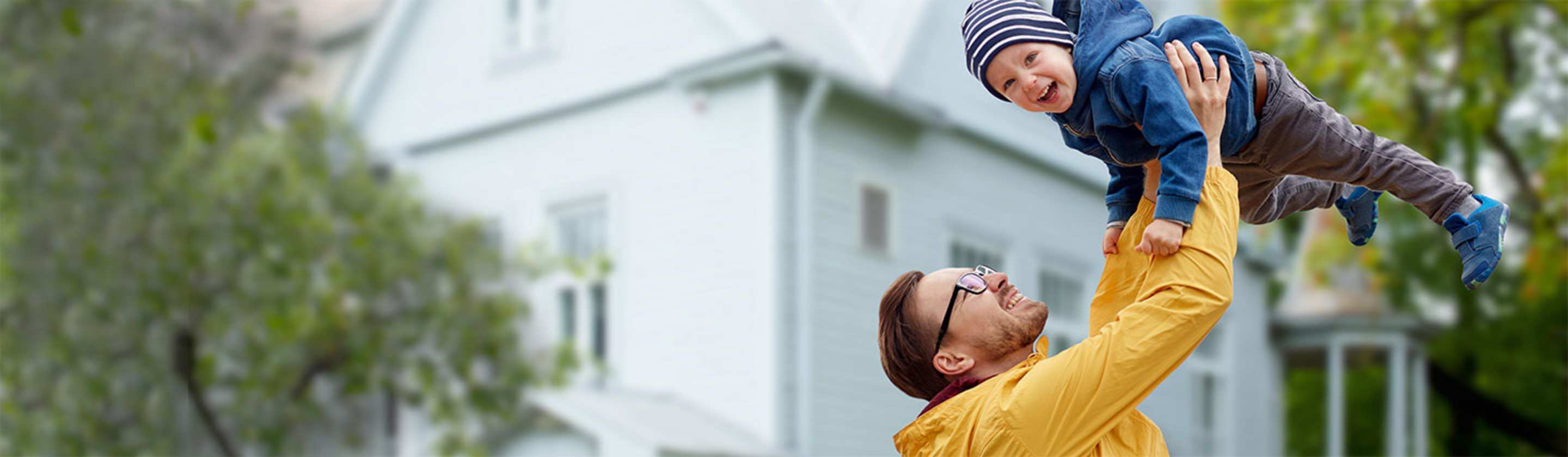 a AAA Member plays outside with his son