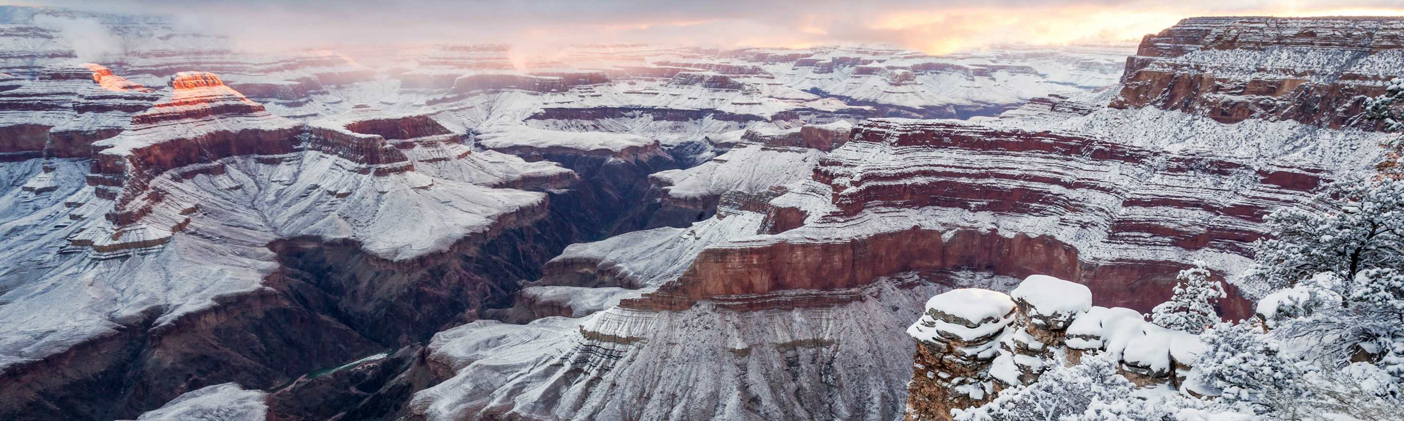 South Rim sunrise panorama with snow from Pima Point at Grand Canyon National Park, Arizona.