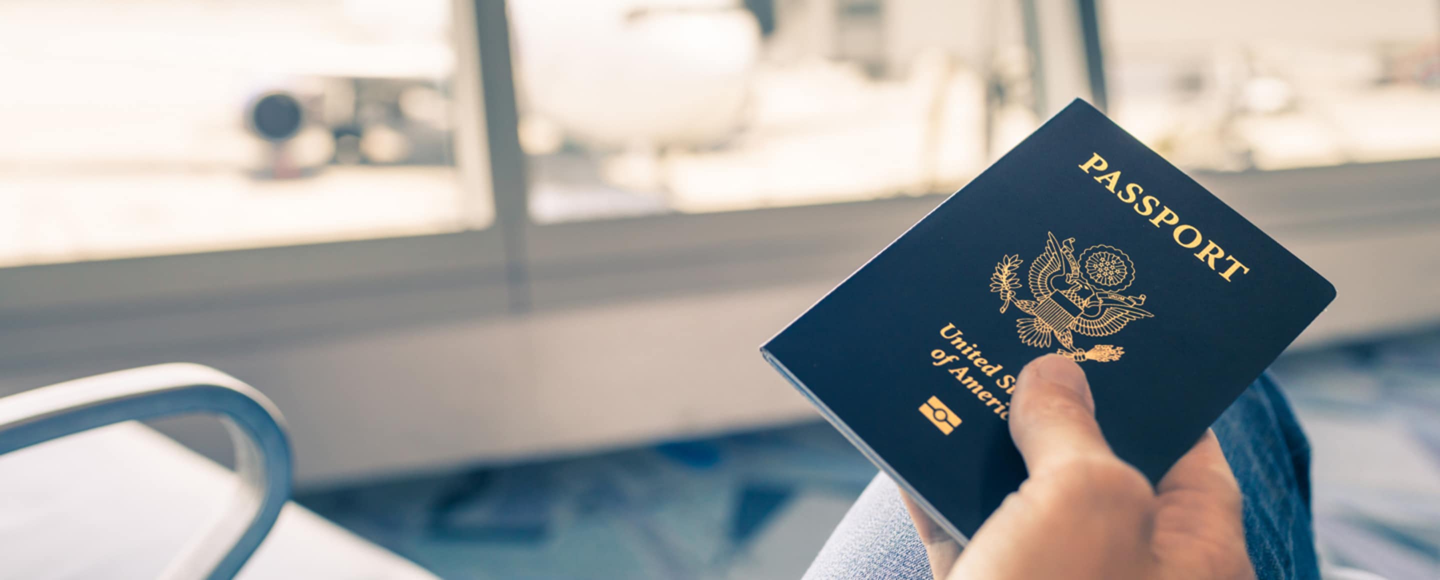 hand holding u.s. passport