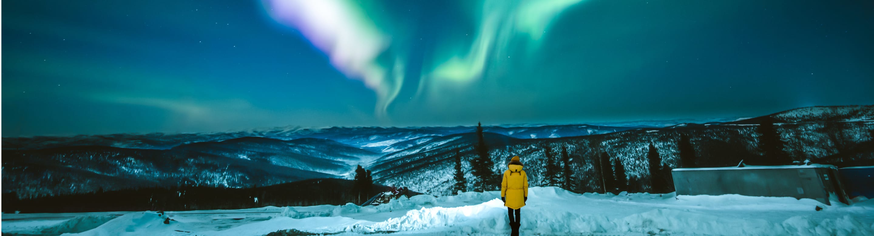 Girl watching Aurora borealis in Fairbanks, Alaska