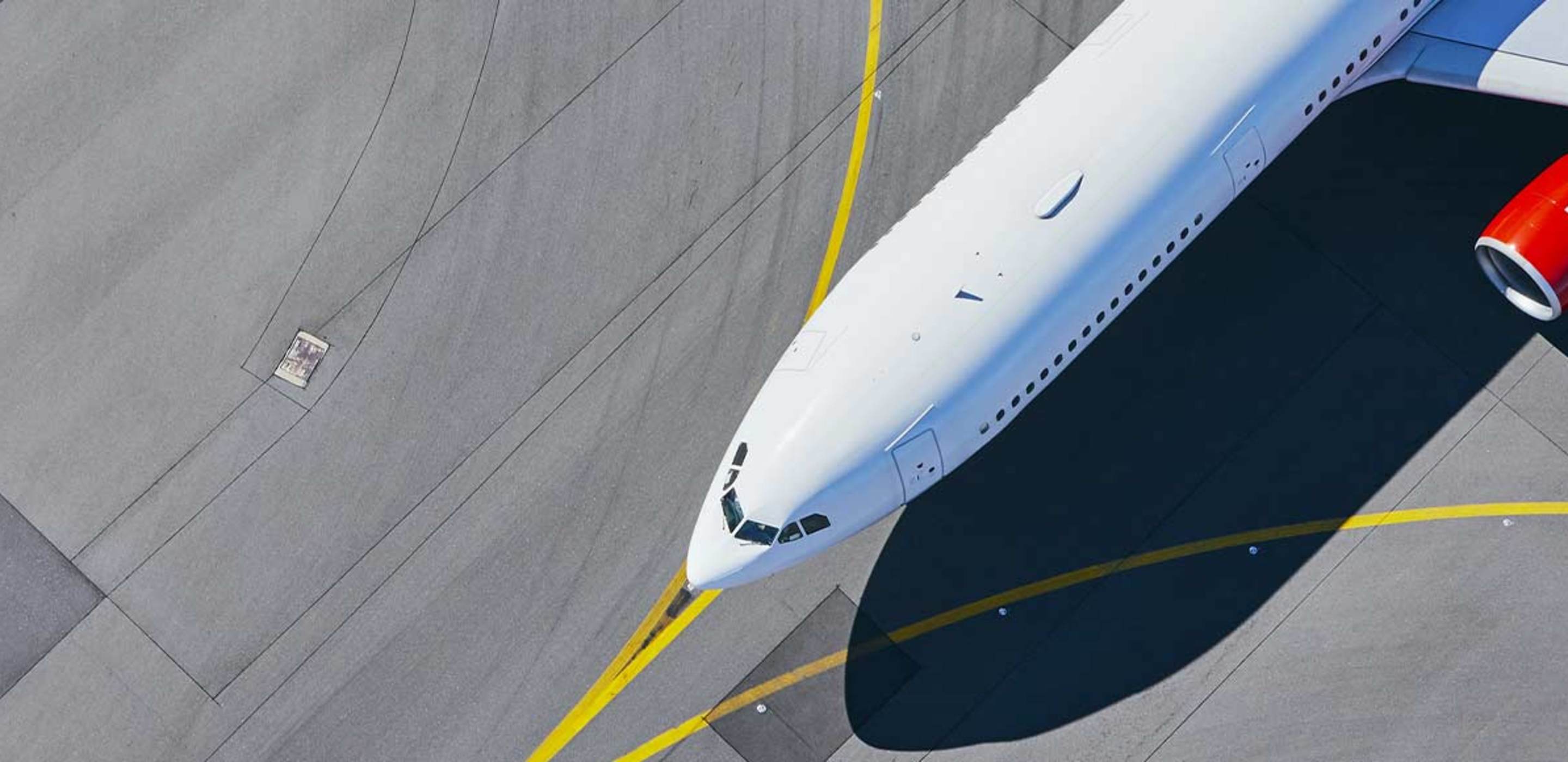 Airplane on a tarmac for a flight booked by AAA