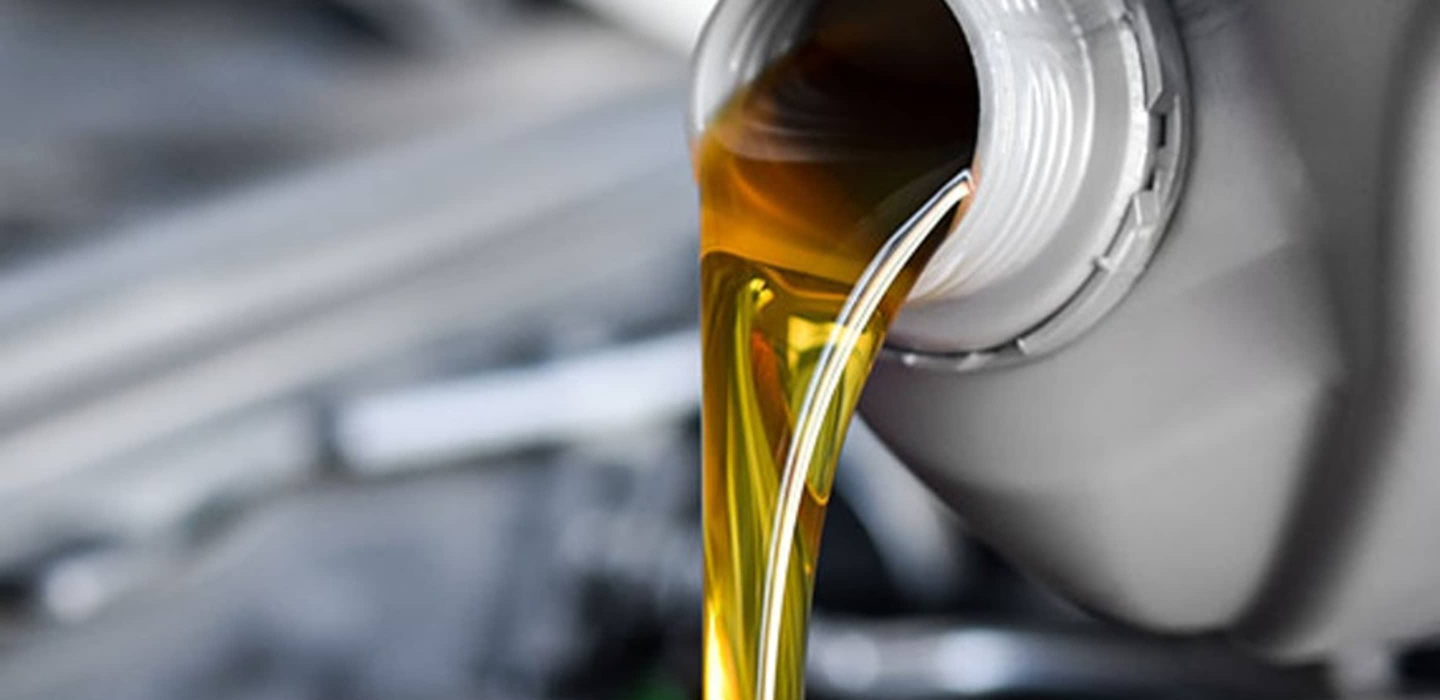 Oil pouring out of container