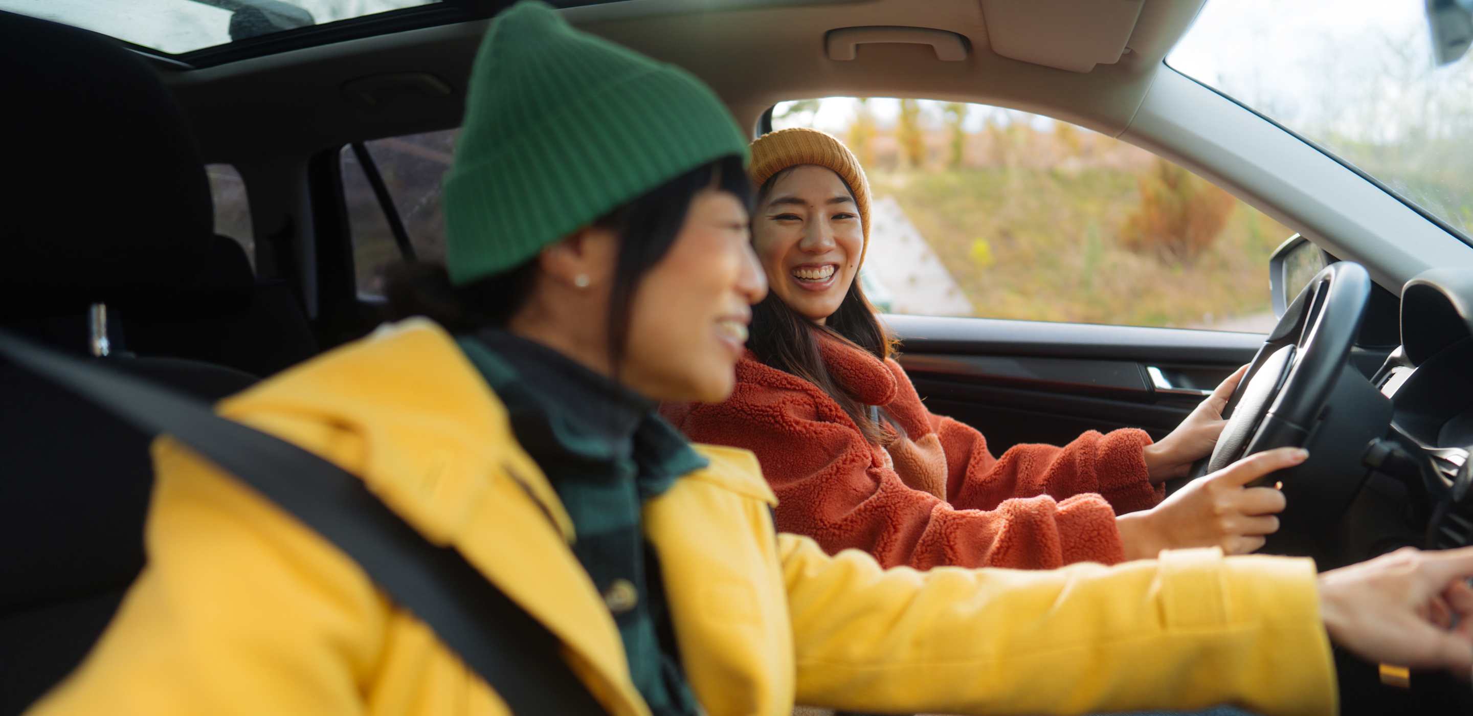 Man and woman driving in car