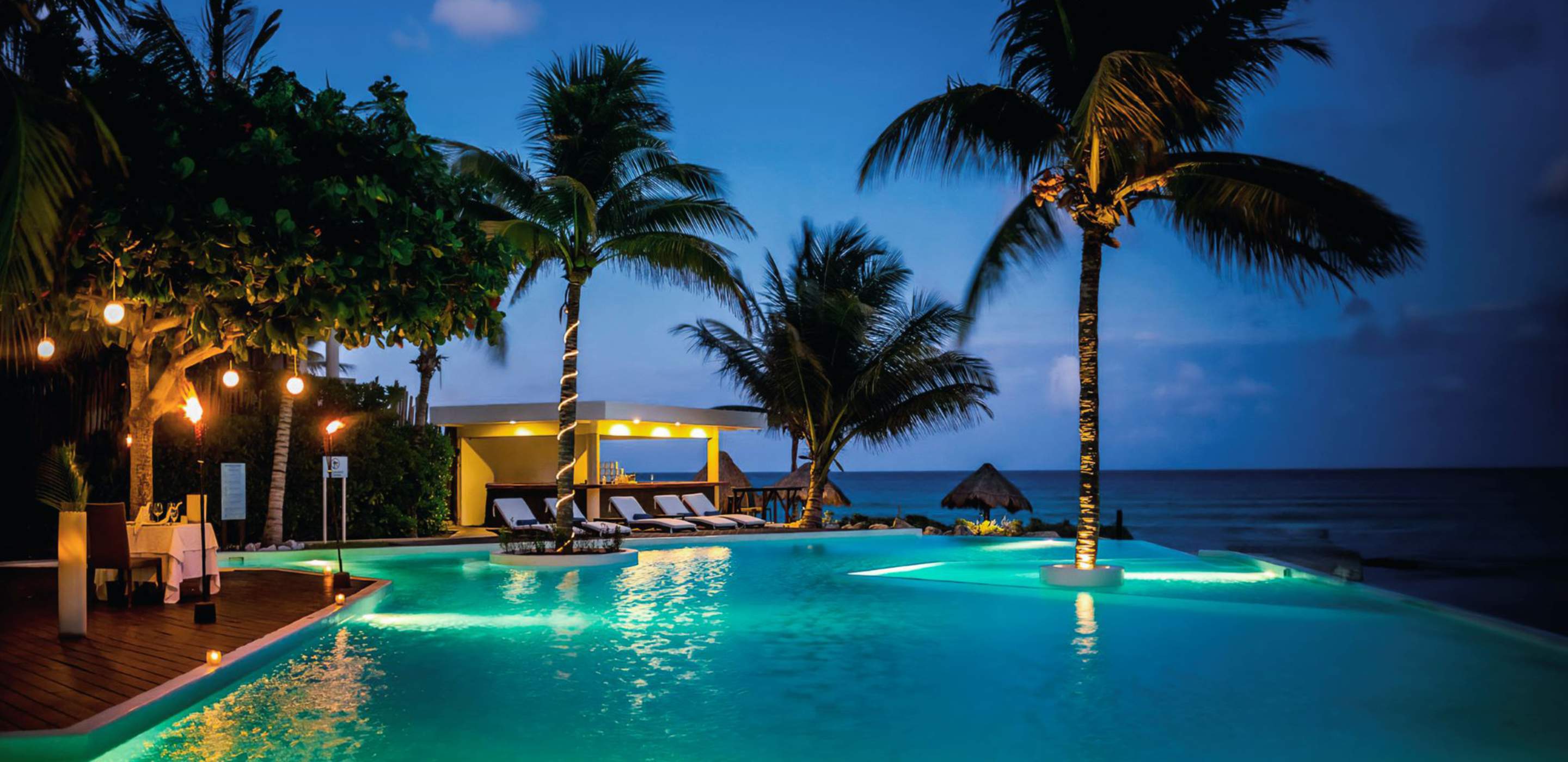 Luxurious bed in a hotel room booked through AAA