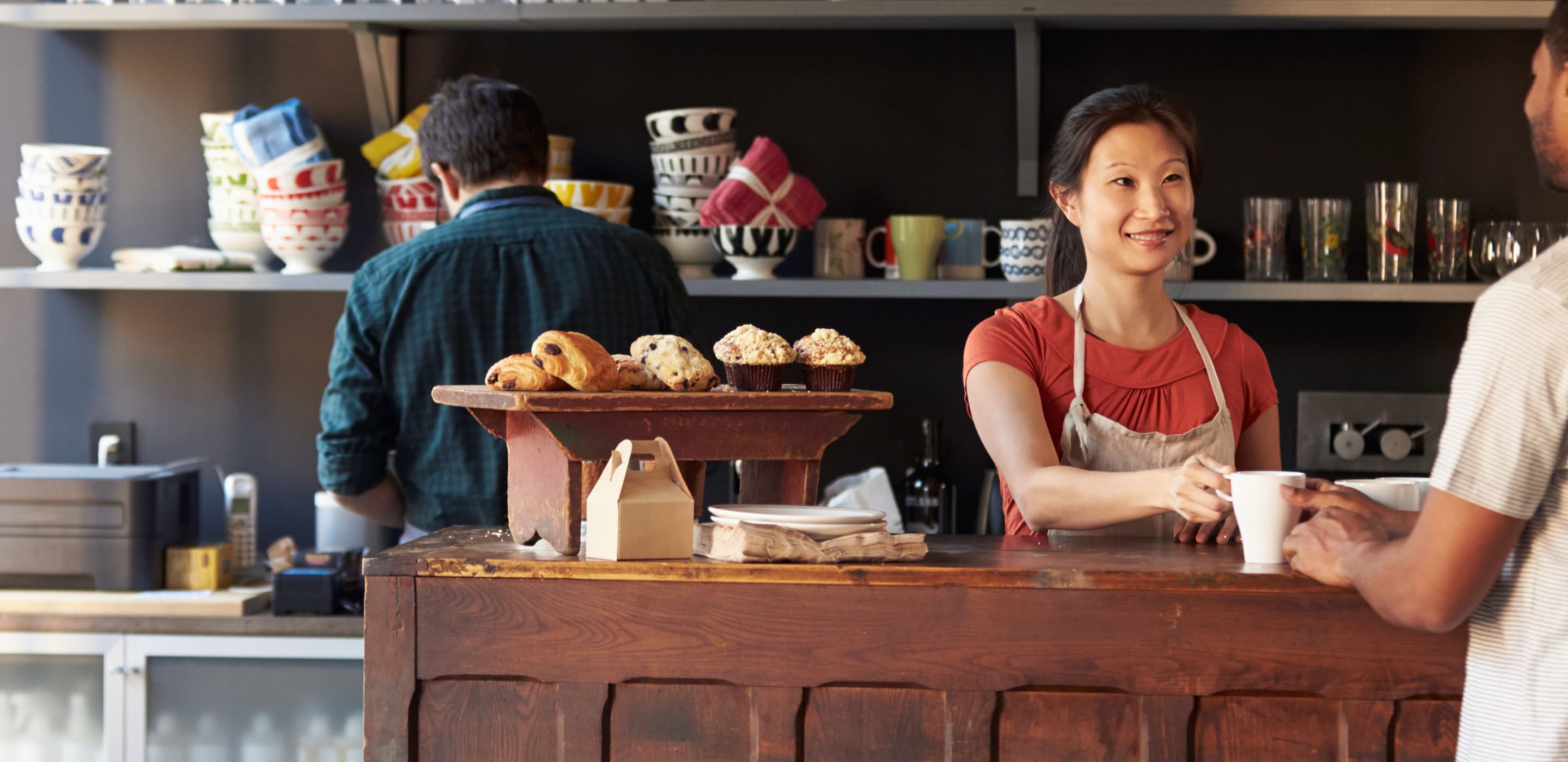 Man buying coffee in coffee shop