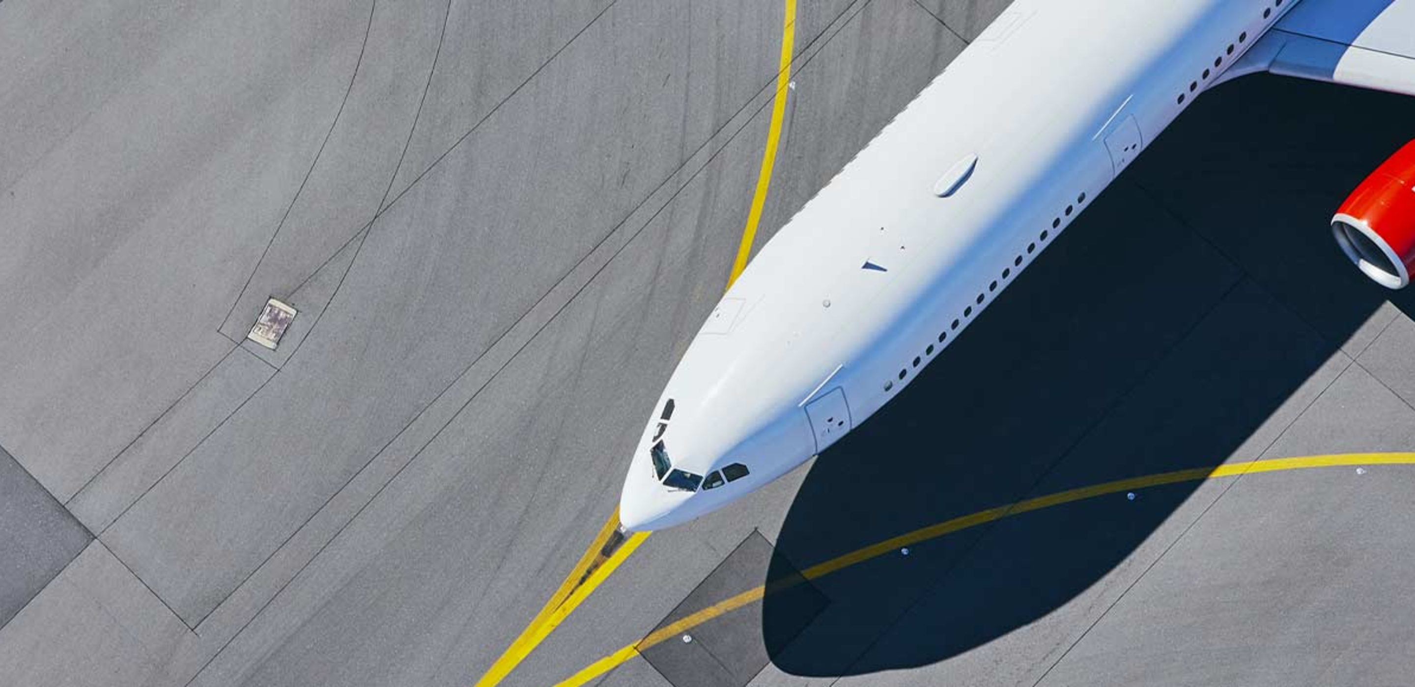 Airplane on a tarmac for a flight booked by AAA