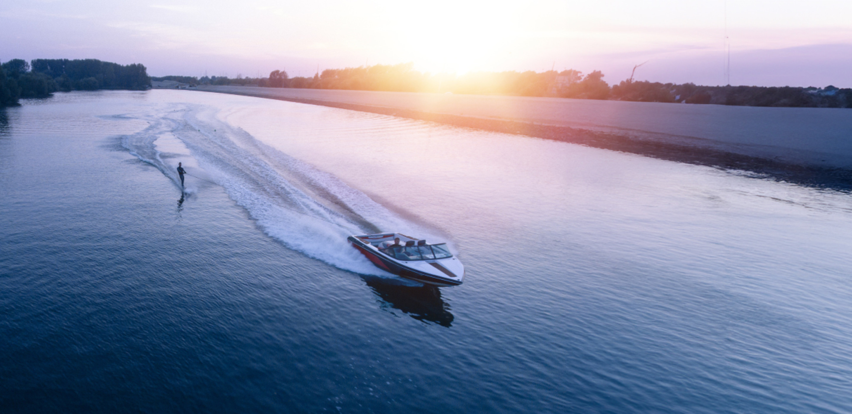 an insured motorized boat glides across the water