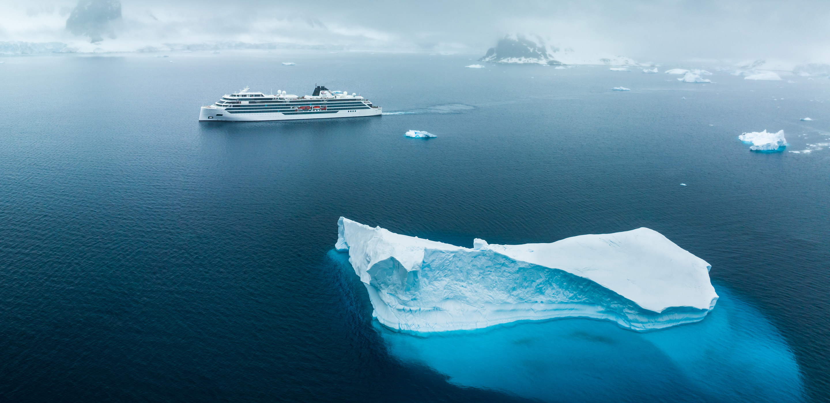 iceberg and viking ship in antarctica