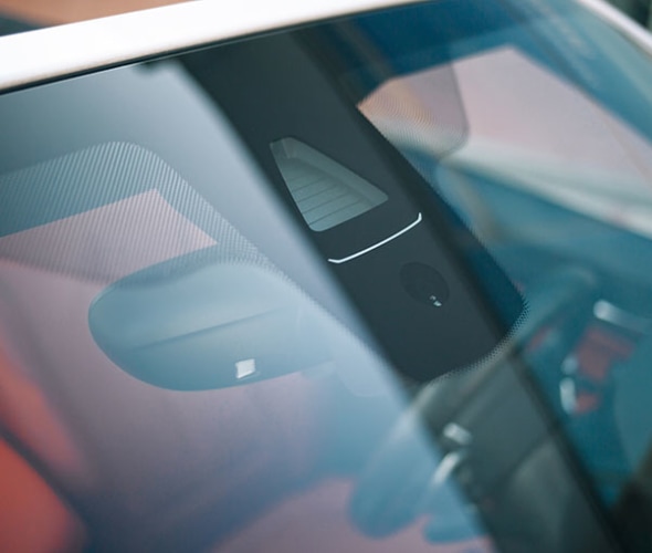 a car with an adas sensor on the windshield is recalibrated by AAA Auto Glass services