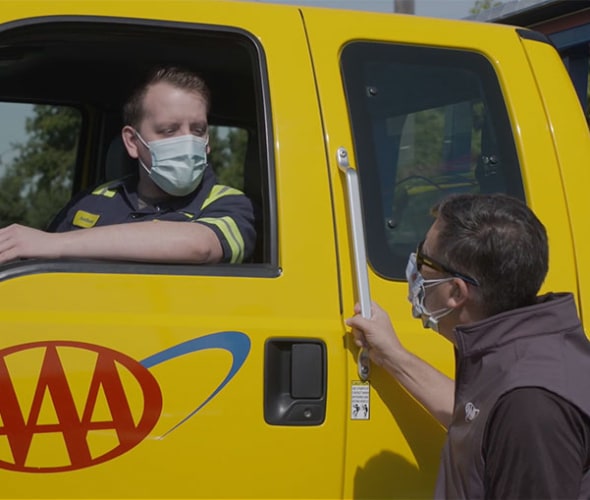 AAA's Todd Burger speaks to a Roadside Service Technician