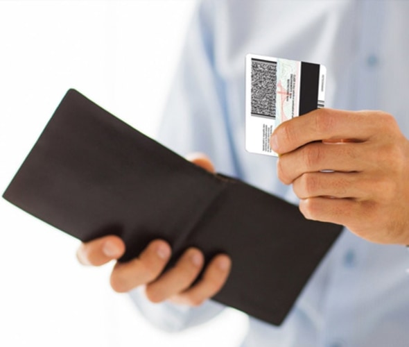 AAA Member pulling a Real ID out of his wallet