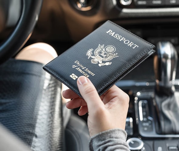 a woman with AAA Mexico driving insurancecrossing the Mexico border with her U.S. passport