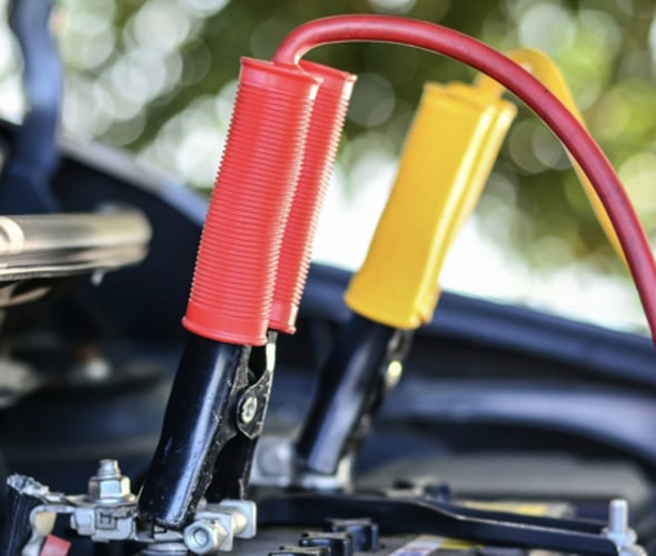 Car battery being diagnosed by AAA Mobile Battery Service