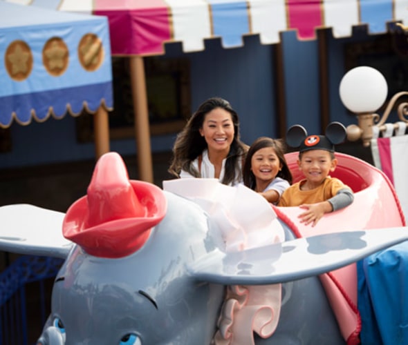 AAA members on the dumbo ride at disneyland on a disney vacation