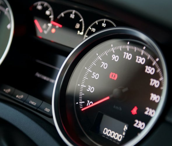 close up of speedometer on a car's dashboard