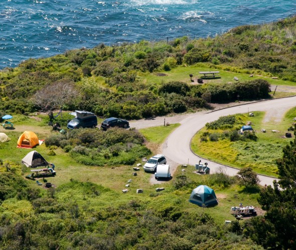 Aerial view of tents set up at Kirk Creek Campground in Los Padres National Forest near Big Sur, California.