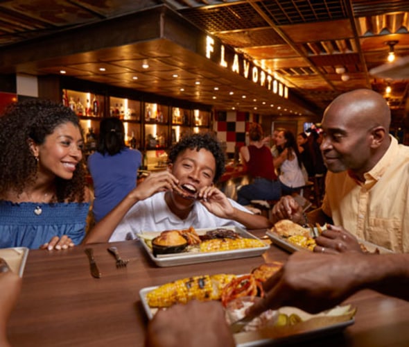 family eating at pig and anchor on carnival cruise line