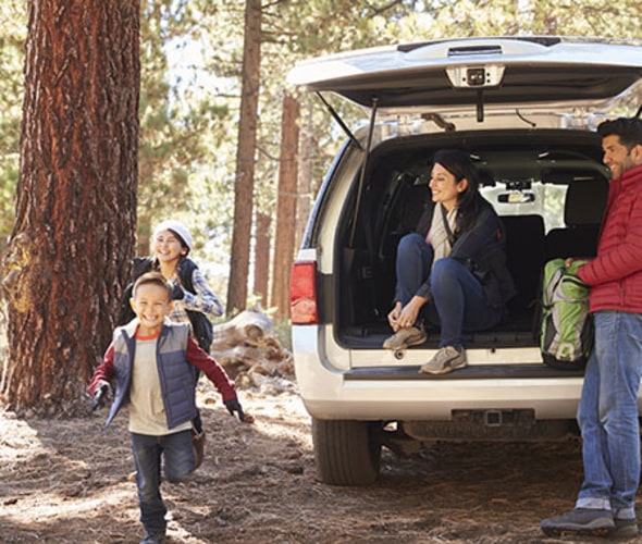 family with AAA car insurance hikes in the pine forest