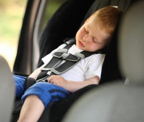 Toddler in a car seat following AAA safety tips