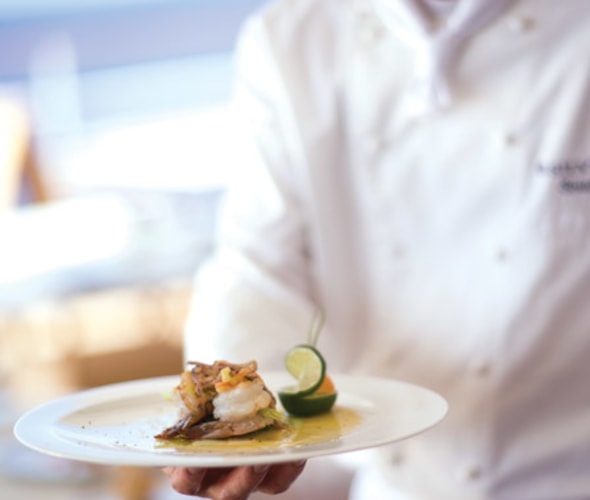 silversea cruises chef with plate of food