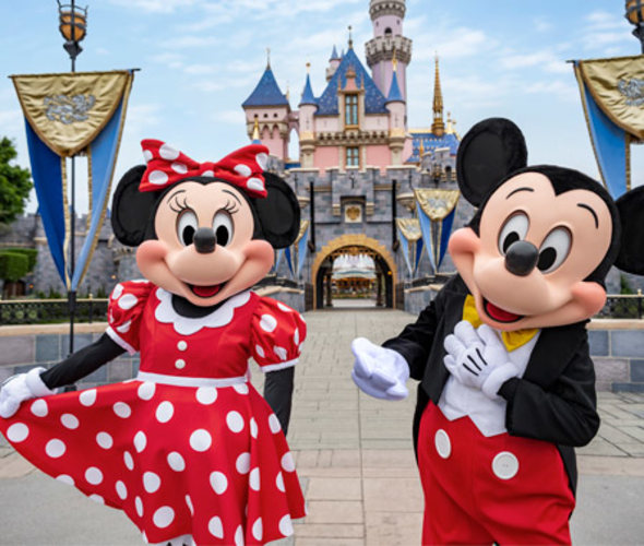 disneyland castle with minnie mouse and mickey mouse 